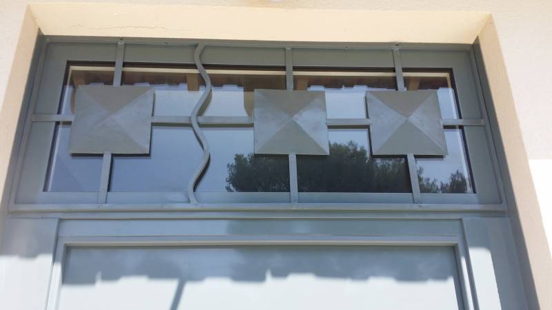 Sécurisation d'un imposte au dessus d'un bloc porte blindé FICHET